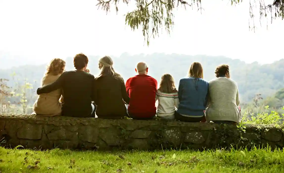 A group of senior friends look over a lush valley