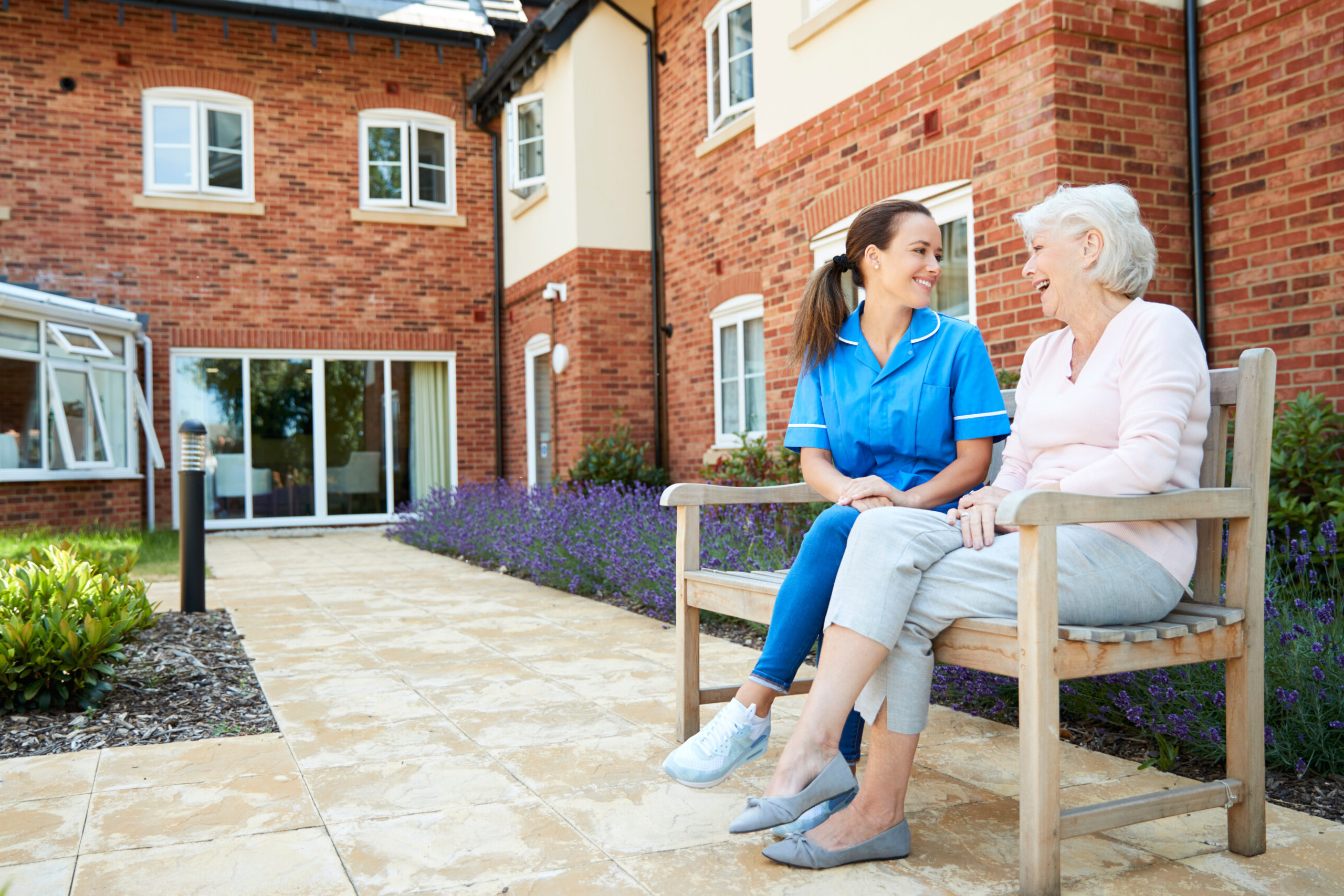 Senior Woman Sitting On Bench